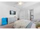 This bedroom offers neutral walls, carpet, a ceiling fan, and a walk-in closet at 310 S Habana Ave # 5, Tampa, FL 33609