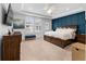 Spacious main bedroom with trey ceiling, dark blue accent wall, and plantation shutters at 310 S Habana Ave # 5, Tampa, FL 33609