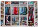 Organized closet with shelves and hanging racks to maximize storage for clothes, shoes and handbags at 310 S Habana Ave # 5, Tampa, FL 33609