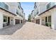 A beautifully maintained facade with individual garages and an elegant stone-paved driveway at 310 S Habana Ave # 5, Tampa, FL 33609