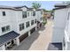 Modern townhouses featuring multiple windows, individual garages, and beautiful paved driveway at 310 S Habana Ave # 5, Tampa, FL 33609