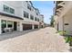 Exterior showcases a pristine façade with attached garages and beautiful paved driveway at 310 S Habana Ave # 5, Tampa, FL 33609