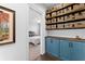 Hallway with built-in storage, wooden cabinets, shelves with baskets, and decor at 310 S Habana Ave # 5, Tampa, FL 33609