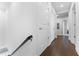 Bright hallway with multiple doorways and dark hardwood floors at 310 S Habana Ave # 5, Tampa, FL 33609