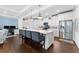 Modern kitchen with island seating, stainless steel appliances, and a workspace at 310 S Habana Ave # 5, Tampa, FL 33609