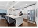 Modern kitchen boasts an island with seating, stainless steel appliances, and white cabinetry at 310 S Habana Ave # 5, Tampa, FL 33609