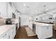 Spacious kitchen featuring a large island, stainless appliances, and white cabinetry at 310 S Habana Ave # 5, Tampa, FL 33609