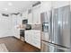 Well-lit kitchen features stainless appliances, white cabinetry, and ample counter space at 310 S Habana Ave # 5, Tampa, FL 33609
