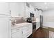 Bright kitchen equipped with stainless steel appliances, modern white cabinets, and ample counter space at 310 S Habana Ave # 5, Tampa, FL 33609