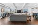 Open-concept living room with hardwood floors, coffered ceilings and bright light at 310 S Habana Ave # 5, Tampa, FL 33609