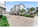 A view of the townhome community from the street showing its well-maintained exteriors and landscaping at 310 S Habana Ave # 5, Tampa, FL 33609