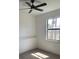 Bright bedroom with a large window and wood-look flooring at 3125 Tucson Rd, North Port, FL 34286