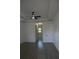 A spacious bedroom featuring recessed ceilings, ceiling fan, and luxury vinyl flooring at 3125 Tucson Rd, North Port, FL 34286