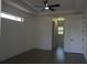 Bedroom with tray ceiling, window, and wood flooring at 3125 Tucson Rd, North Port, FL 34286