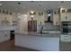 Modern kitchen with a large island, stainless appliances, and pendant lighting at 3125 Tucson Rd, North Port, FL 34286