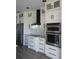 Bright kitchen showcases white cabinets, stainless steel appliances, and a modern backsplash at 3125 Tucson Rd, North Port, FL 34286