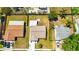 Aerial view of neighboring homes and yards with lush green grass and a nice neighborhood at 3145 Munson St, New Port Richey, FL 34655