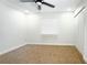 A vacant bedroom provides a blank canvas with a ceiling fan and neutral carpet at 3145 Munson St, New Port Richey, FL 34655