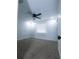 A vacant bedroom provides a blank canvas with a ceiling fan and neutral carpet at 3145 Munson St, New Port Richey, FL 34655