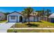Exterior of the home featuring a palm tree in the yard at 3145 Munson St, New Port Richey, FL 34655