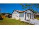 Exterior view of a well-kept home showcasing its side yard and screened-in porch area at 3145 Munson St, New Port Richey, FL 34655
