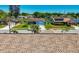 Street view of the homes in the neighborhood featuring a lake and several trees at 3145 Munson St, New Port Richey, FL 34655