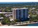 Aerial view of a luxury high-rise building surrounded by lush greenery at 3301 Bayshore Blvd # 2207B, Tampa, FL 33629