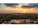 Sunset aerial view of a coastal community featuring lush greenery, sports fields, and dramatic cloudscape at 3301 Bayshore Blvd # 2207B, Tampa, FL 33629