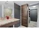 Bathroom features granite countertops, wood cabinets, and decorative mosaic tile shower at 3301 Bayshore Blvd # 2207B, Tampa, FL 33629