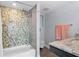 Bathroom featuring a modern tub and shower with designer tile, granite countertop and updated fixtures at 3301 Bayshore Blvd # 2207B, Tampa, FL 33629