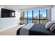 Bedroom includes ocean views from large windows, TV, and a guitar at 3301 Bayshore Blvd # 2207B, Tampa, FL 33629