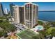 High rise property featuring a swimming pool, tennis court, parking and water views at 3301 Bayshore Blvd # 2207B, Tampa, FL 33629