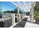Outdoor grilling station with stainless steel gas grills, counter space, and a pergola for shade at 3301 Bayshore Blvd # 2207B, Tampa, FL 33629