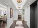 Elegant hallway featuring hardwood floors, recessed lighting, decorative light fixtures, and elevator access at 3301 Bayshore Blvd # 2207B, Tampa, FL 33629