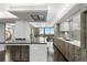 Contemporary kitchen with a center island, modern appliances, designer backsplash, and an adjacent dining area at 3301 Bayshore Blvd # 2207B, Tampa, FL 33629