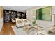 Cozy living room featuring a built-in bookcase, comfortable chairs, and elegant decor at 3301 Bayshore Blvd # 2207B, Tampa, FL 33629
