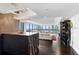 Modern living room with floor to ceiling windows, water view, wet bar and hardwood floors at 3301 Bayshore Blvd # 2207B, Tampa, FL 33629