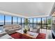 Bright living room with large windows, water view, hardwood floors and comfortable seating at 3301 Bayshore Blvd # 2207B, Tampa, FL 33629