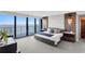 Serene main bedroom with water views, contemporary lighting, and a padded headboard at 3301 Bayshore Blvd # 2207B, Tampa, FL 33629