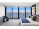 Bright main bedroom featuring access to a balcony and expansive water views at 3301 Bayshore Blvd # 2207B, Tampa, FL 33629