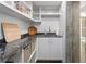Convenient pantry featuring custom storage solutions, granite countertop and modern fixtures at 3301 Bayshore Blvd # 2207B, Tampa, FL 33629