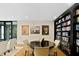 Comfortable reading room with a bookcase, round table, and chairs at 3301 Bayshore Blvd # 2207B, Tampa, FL 33629