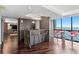 Modern wet bar with water view, bar stools and a table for drinks at 3301 Bayshore Blvd # 2207B, Tampa, FL 33629