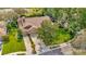 Aerial view of a well-manicured property with lush landscaping, mature trees, and a long driveway at 3427 Forest Bridge Cir, Brandon, FL 33511