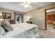 Bedroom with dresser, neutral walls, carpet, and sliding glass doors leading to the lanai at 3427 Forest Bridge Cir, Brandon, FL 33511