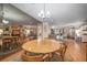 Open dining area with wood floors offering easy access to the living room and other areas of the home at 3427 Forest Bridge Cir, Brandon, FL 33511