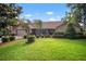 Charming brick home features a lush lawn and well-manicured landscaping at 3427 Forest Bridge Cir, Brandon, FL 33511