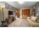 Living room with carpet, television, and wooden closet at 3427 Forest Bridge Cir, Brandon, FL 33511