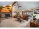 Warm living room features a fireplace, comfortable leather seating, and access to an outdoor patio at 3427 Forest Bridge Cir, Brandon, FL 33511