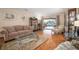 Comfortable living room showcasing a glass coffee table and easy access to the outdoor pool area at 3427 Forest Bridge Cir, Brandon, FL 33511